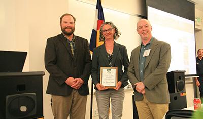 Dr. Linda Nagel receiving the 2019 CO/WY SAF Citizenship Award, with the CO/WY SAF Awards Chair (Sam Pankratz) and the CO/WY Chapter Chair (Chris Farley); Photo Credit: Phil Hoefer